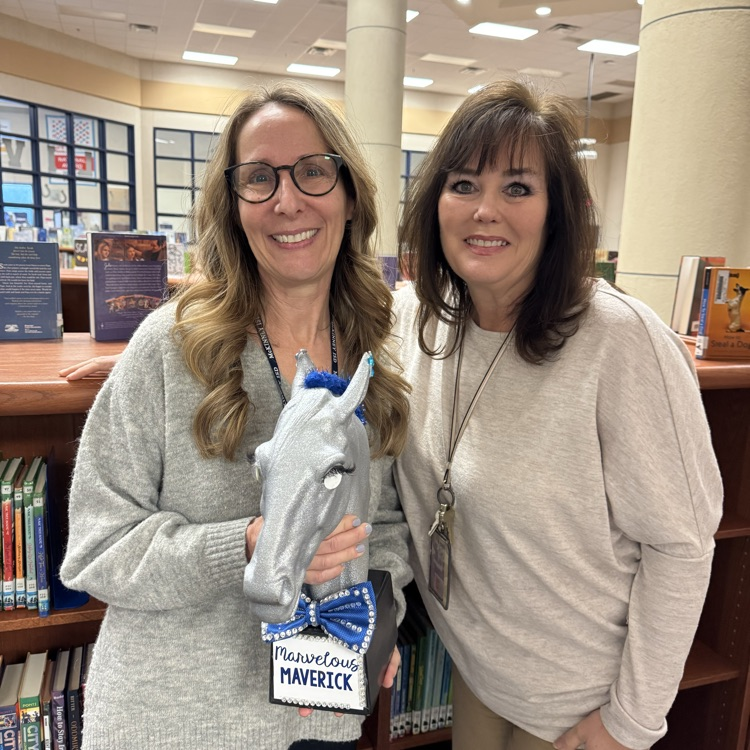 picture of Mrs. Columbus holding Marvelous Maverick Award