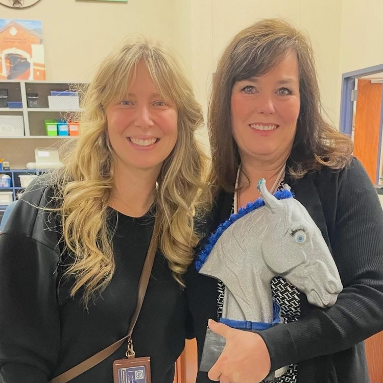 picture of Mrs. Hix holding Marvelous Maverick award