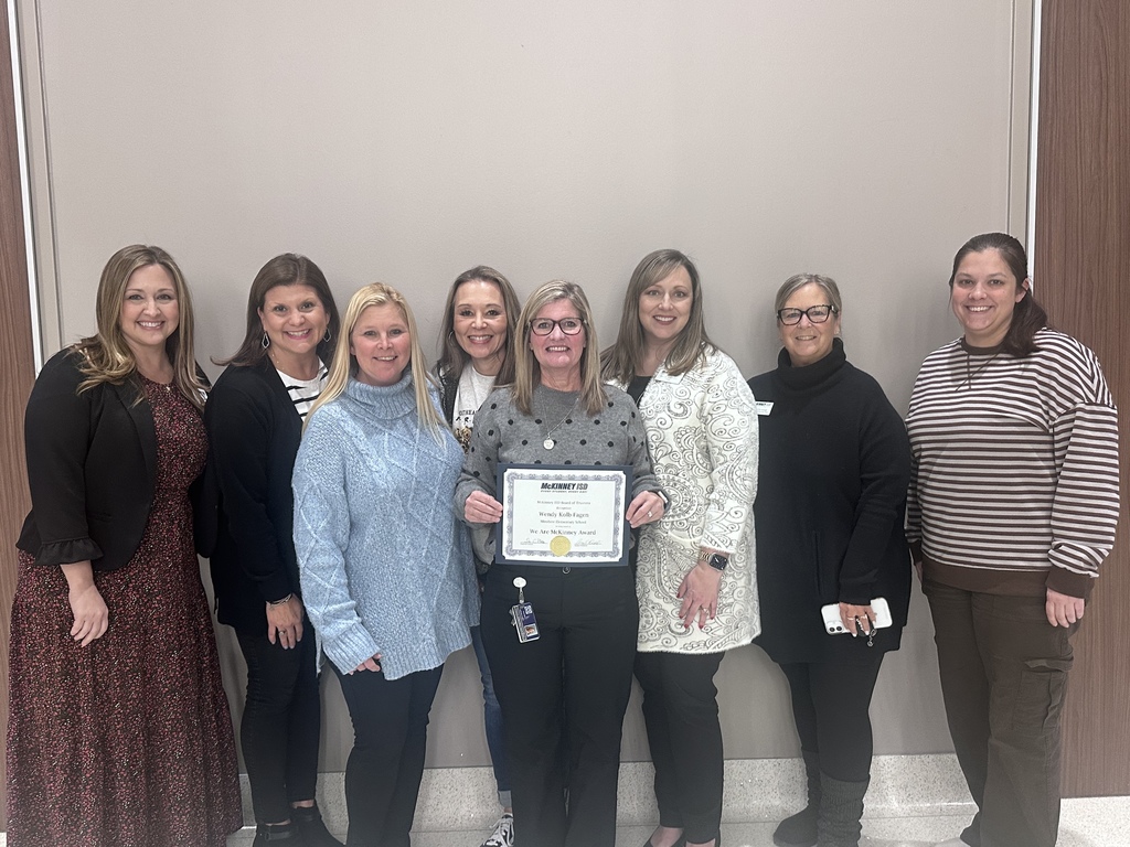 Kolb-Fagen awarded at school board meeting with fellow teachers.