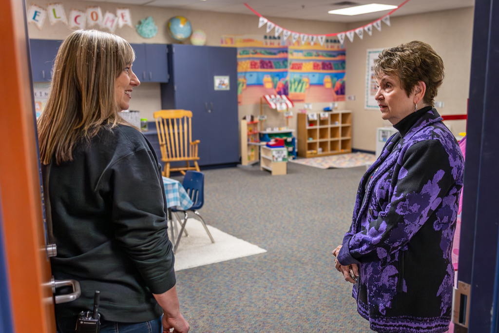 Larriviere and Sperry standing in doorway talking