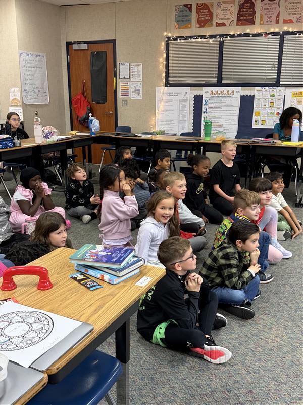 2nd grade enjoying 5th grade reader theather