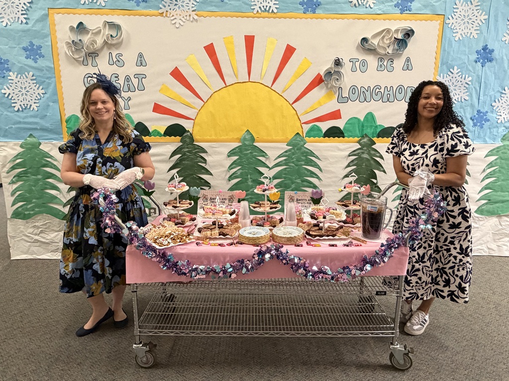 The image shows Mrs. Hooten and Mrs. Roberts with a cart full of sweets for the staff members at Wilmeth.