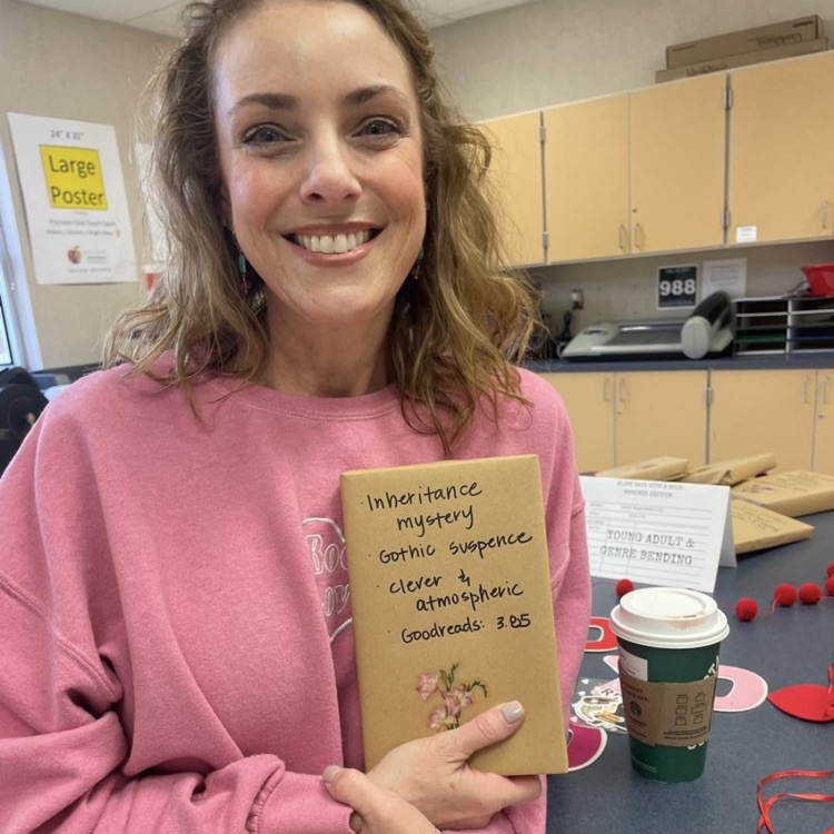 Ms. Harper holding a book