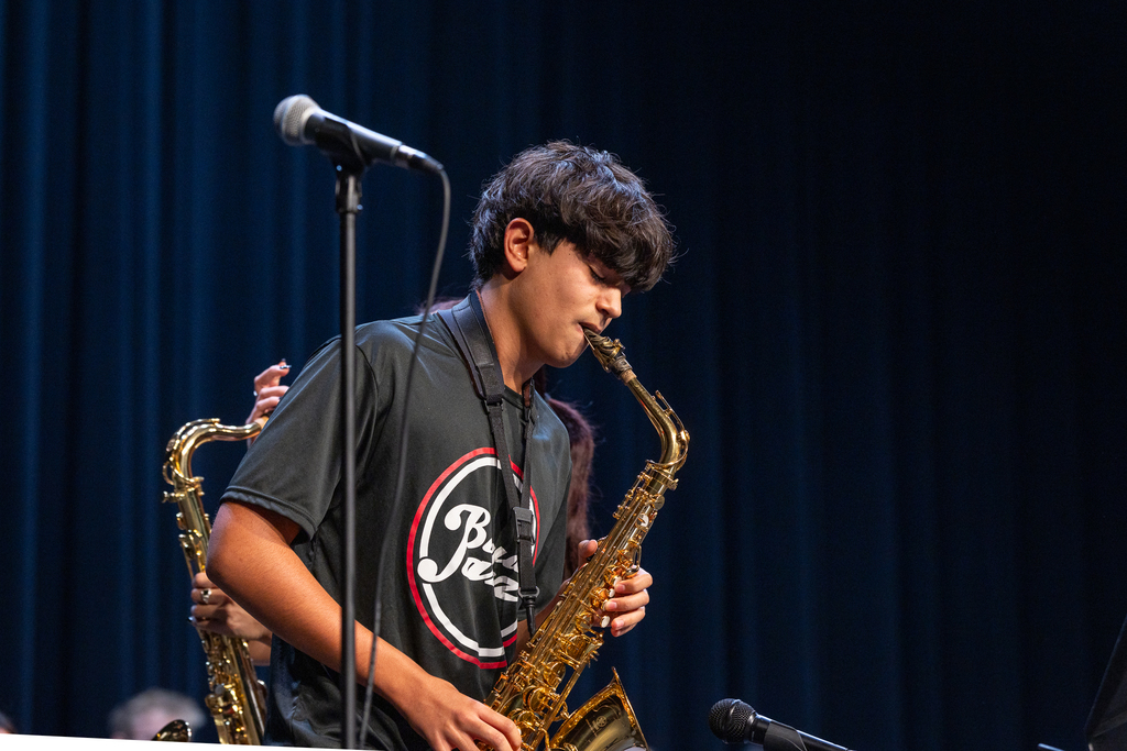male student performing saxophone solo