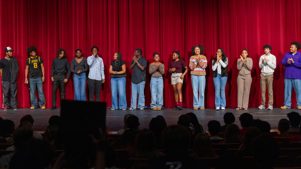 performers lined up onstage at the end of the show