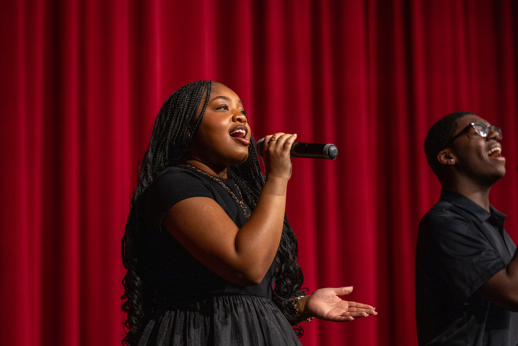 male and female singing duet onstage