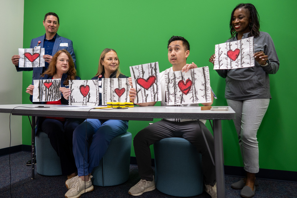medical city staff join art teacher danh nguyen during the morning announcements at finch elementary 