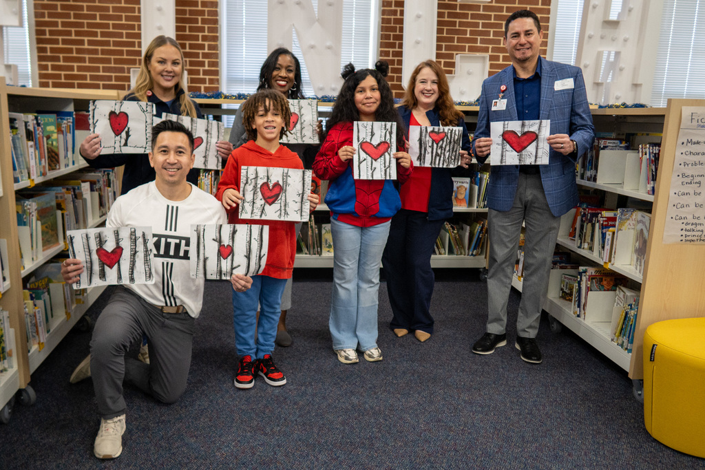 students at finch elementary present heart paintings to the staff at medical city mckinney 