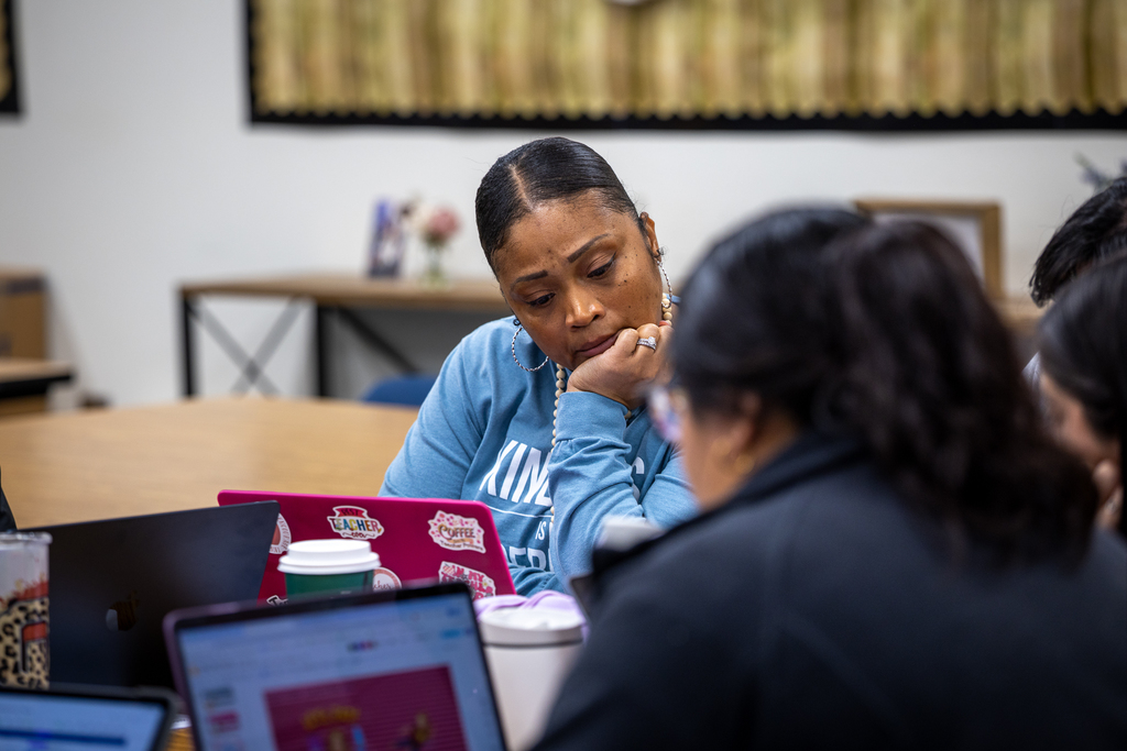 female teachers working at desks during session