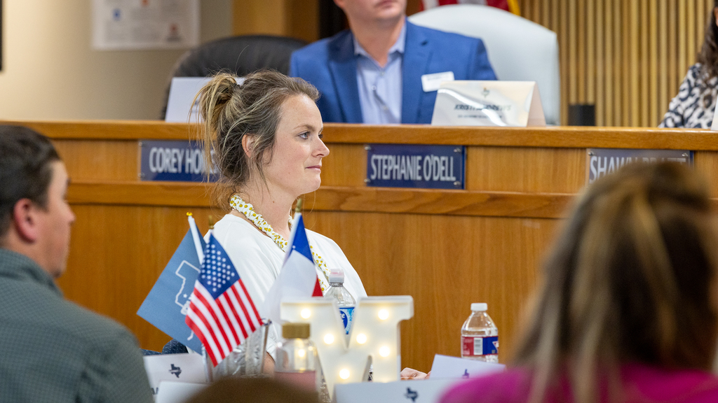 female teacher listening during panel