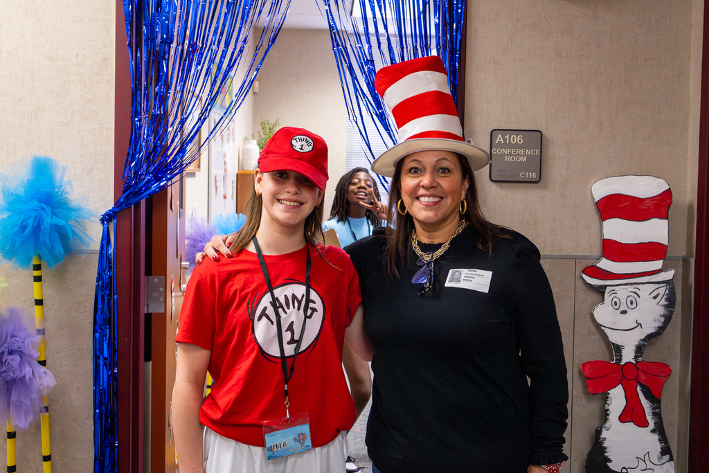 Mom in cat in the hat costume and daughter in Thing 1 costume at Minshew Elementary