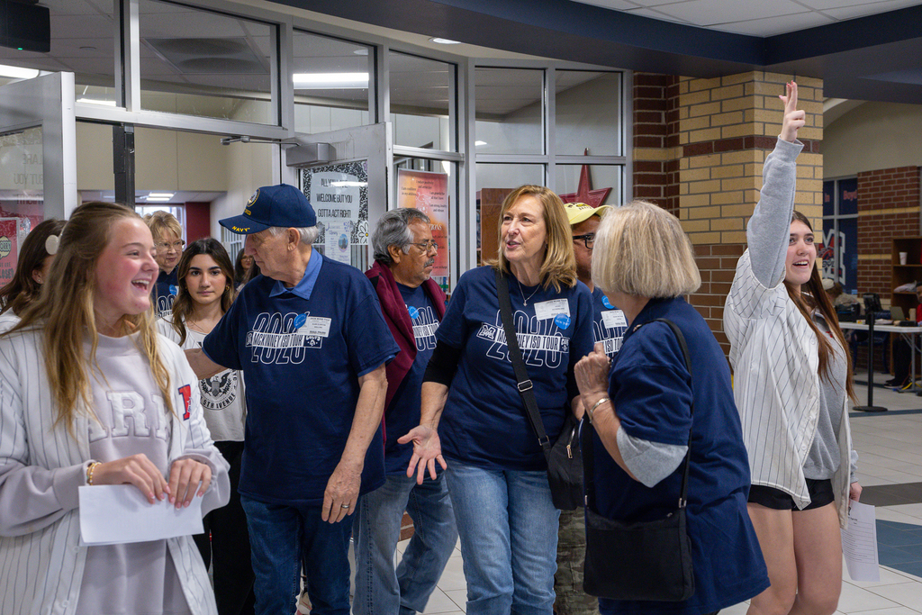 group of PALS students and guests leaving the library while laughing and talking