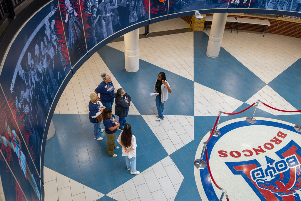 view from above Boyd rotunda where female PALS student is talking to group of guests