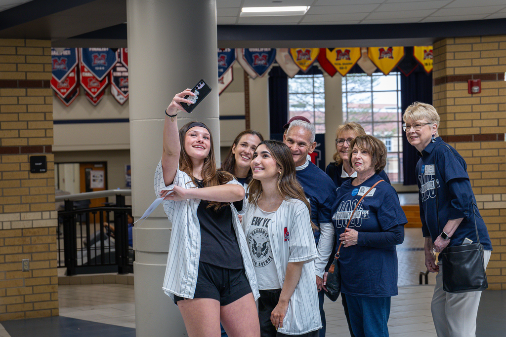 PALS students taking a selfie with tour guests