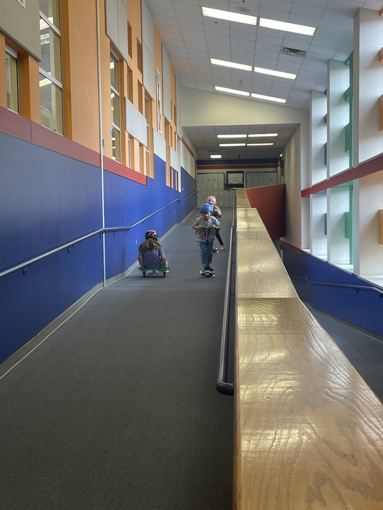 students on scooters