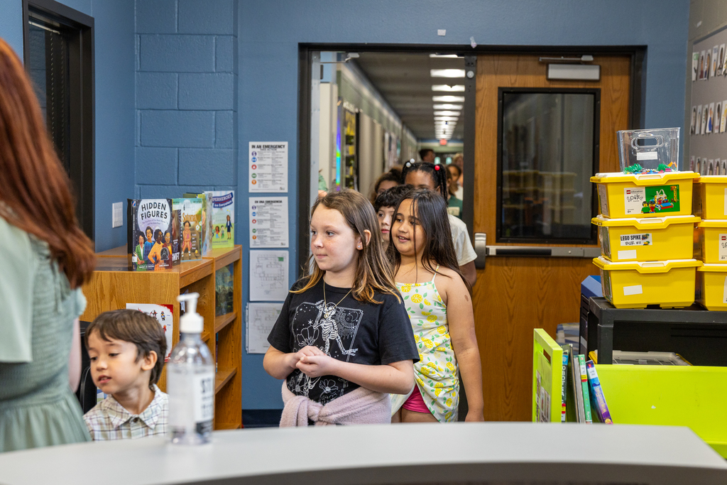 line of students walking into the library