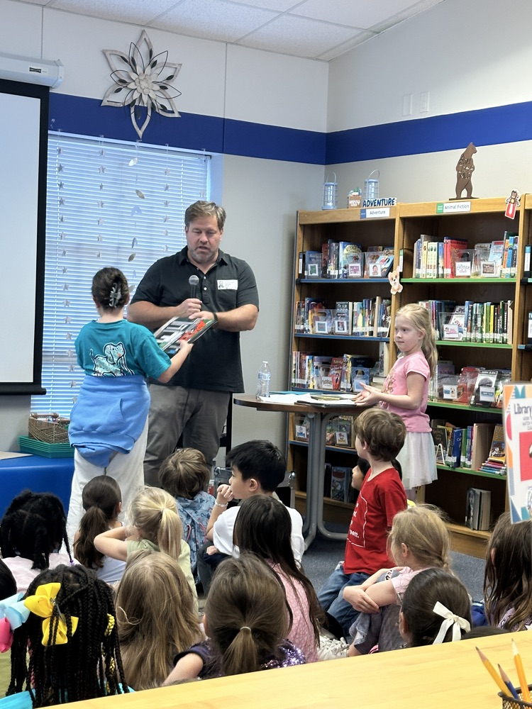 2nd grade- passing out books