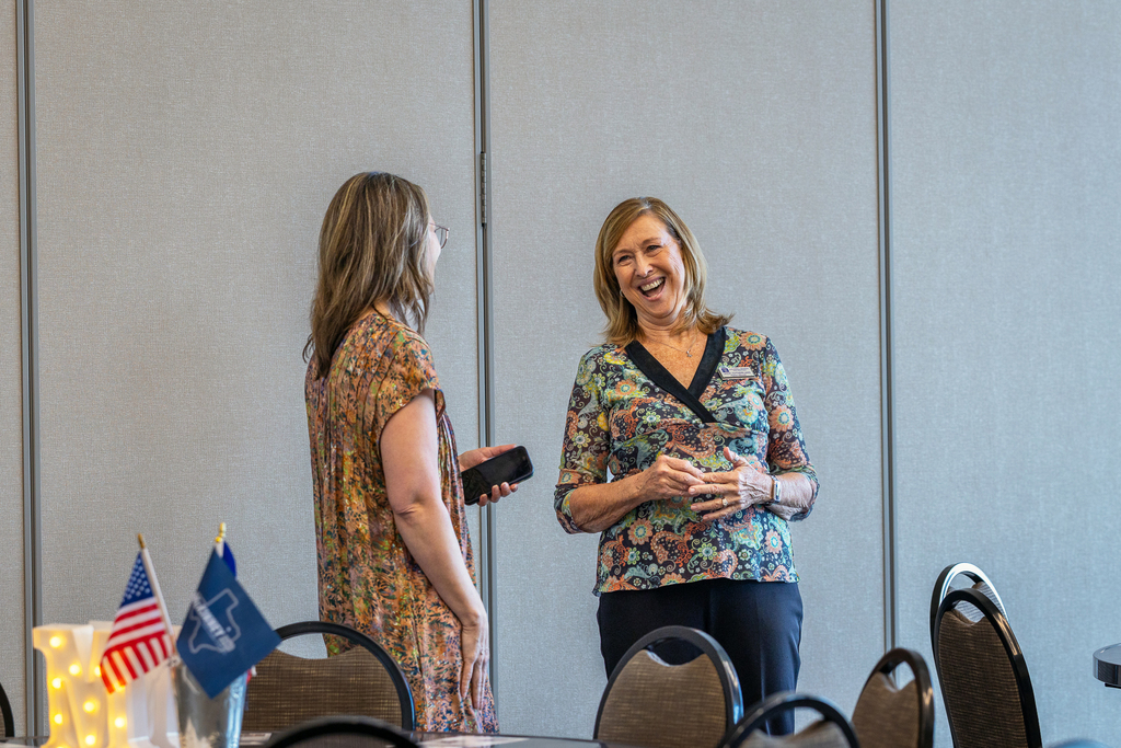 realtors standing and talking and laughing