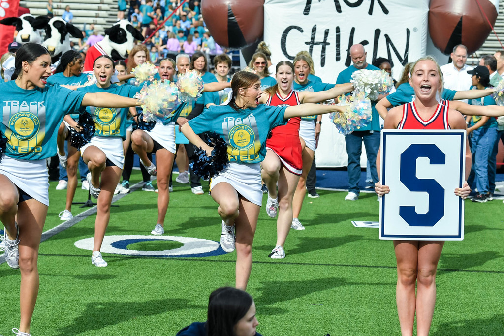 MISD high school cheerleaders cheering before the event