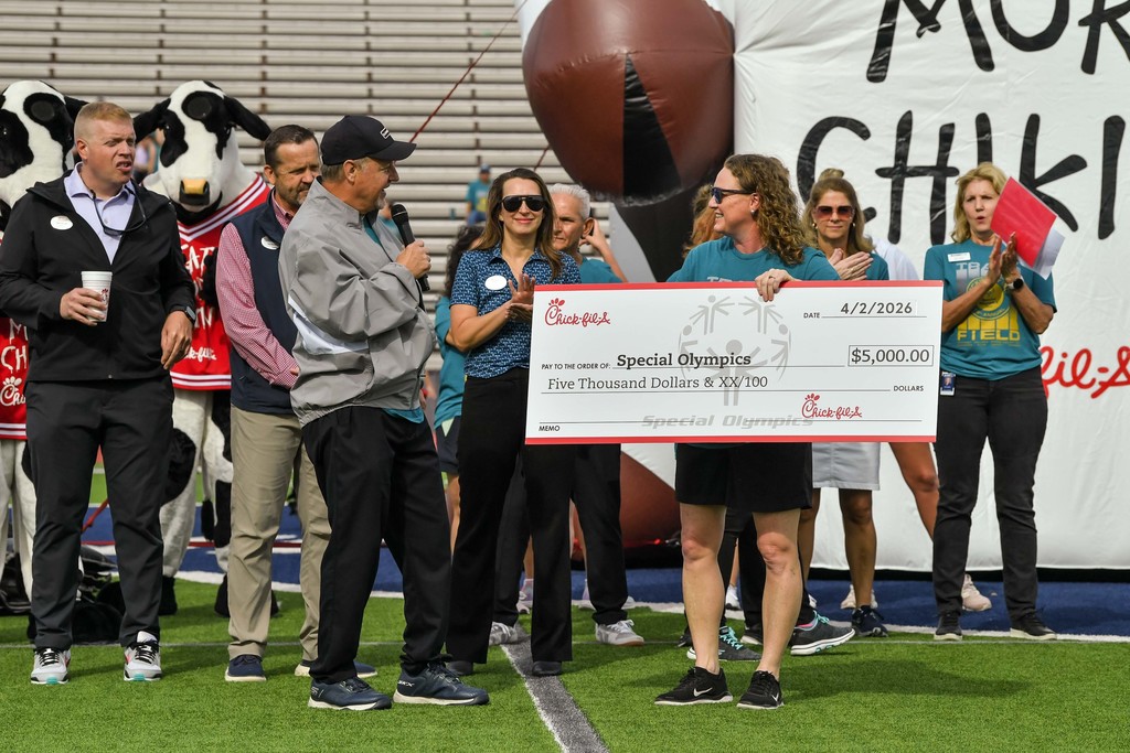 MISD representative accepting check from Chick Fil A