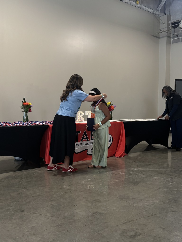 Zoey Patel, Wilmeth Artist at TAEA Youth Art Month ceremony receiving a medal for her work.