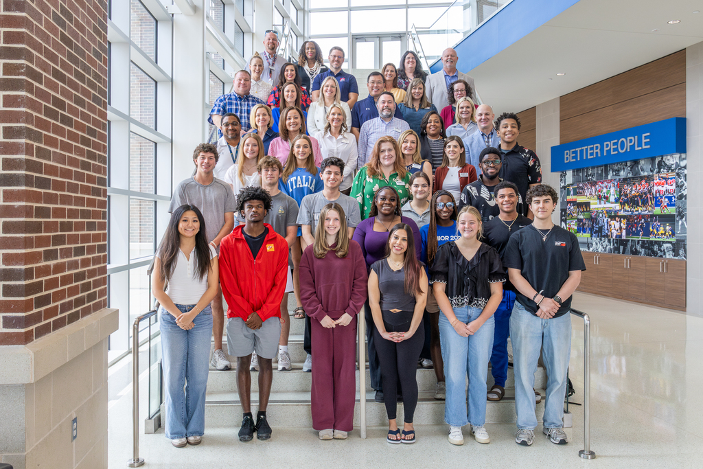 photo of entire group on stairs in foyer of CEC