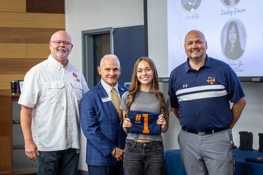 Valedictorian Rafaela Zentner holding #1 shirt