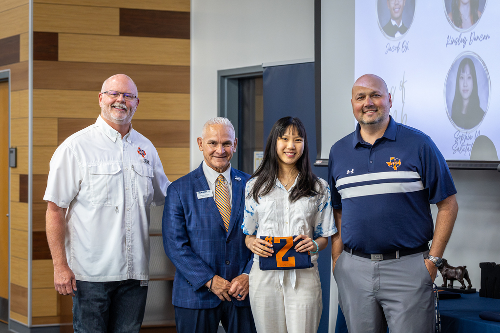 Salutatorian Sophie Yu holding #2 shirt