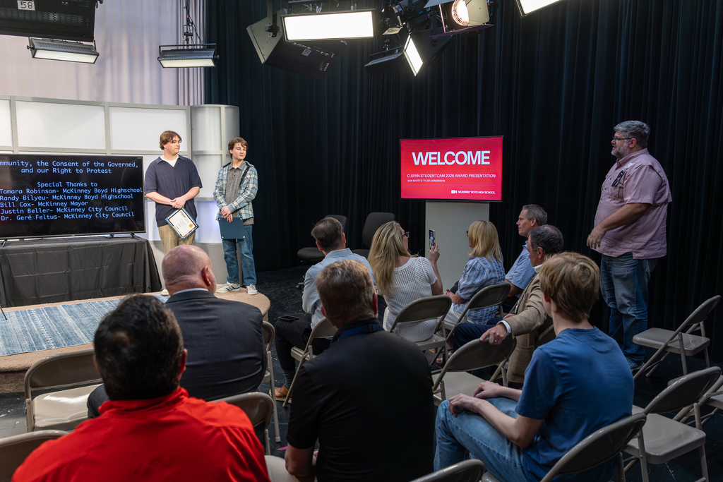 Justin Beller speaking from seats