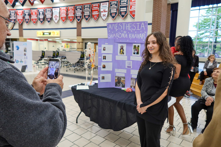 a student poses for a photo at ISM final presentation night 