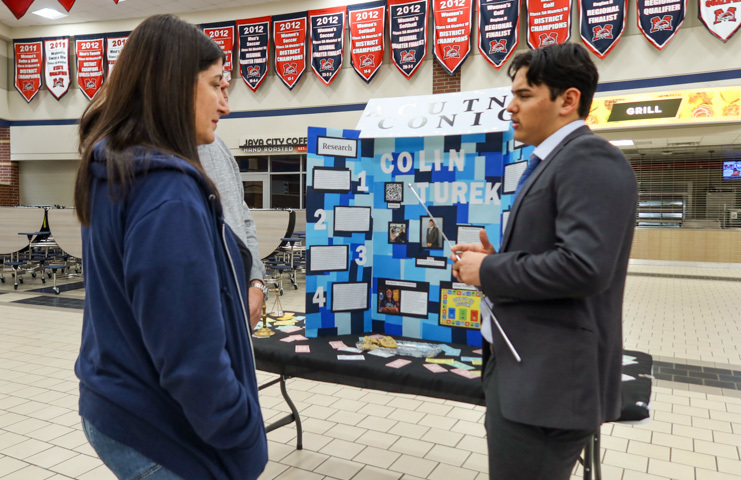 a student presents research during ISM final presentation night 