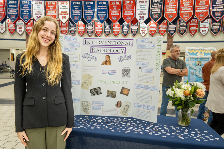 a student presents research on interventional radiology at ISM final presentation night 