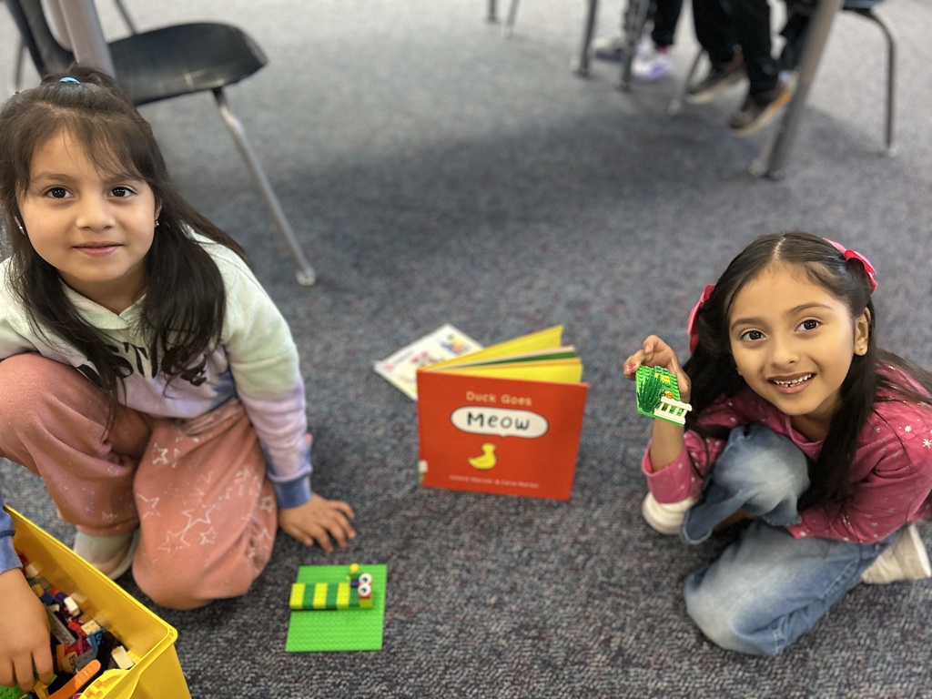 Students using Legos to  retell parts of a story