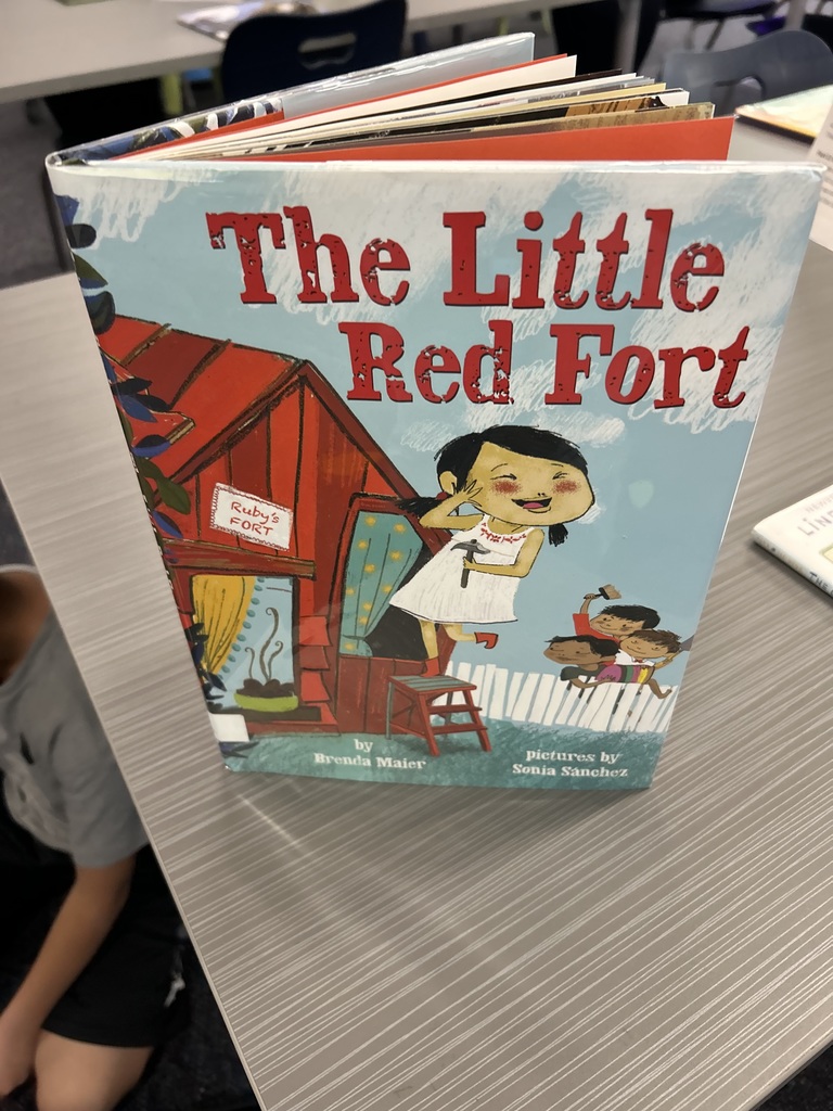 Students using Legos to  retell parts of a story