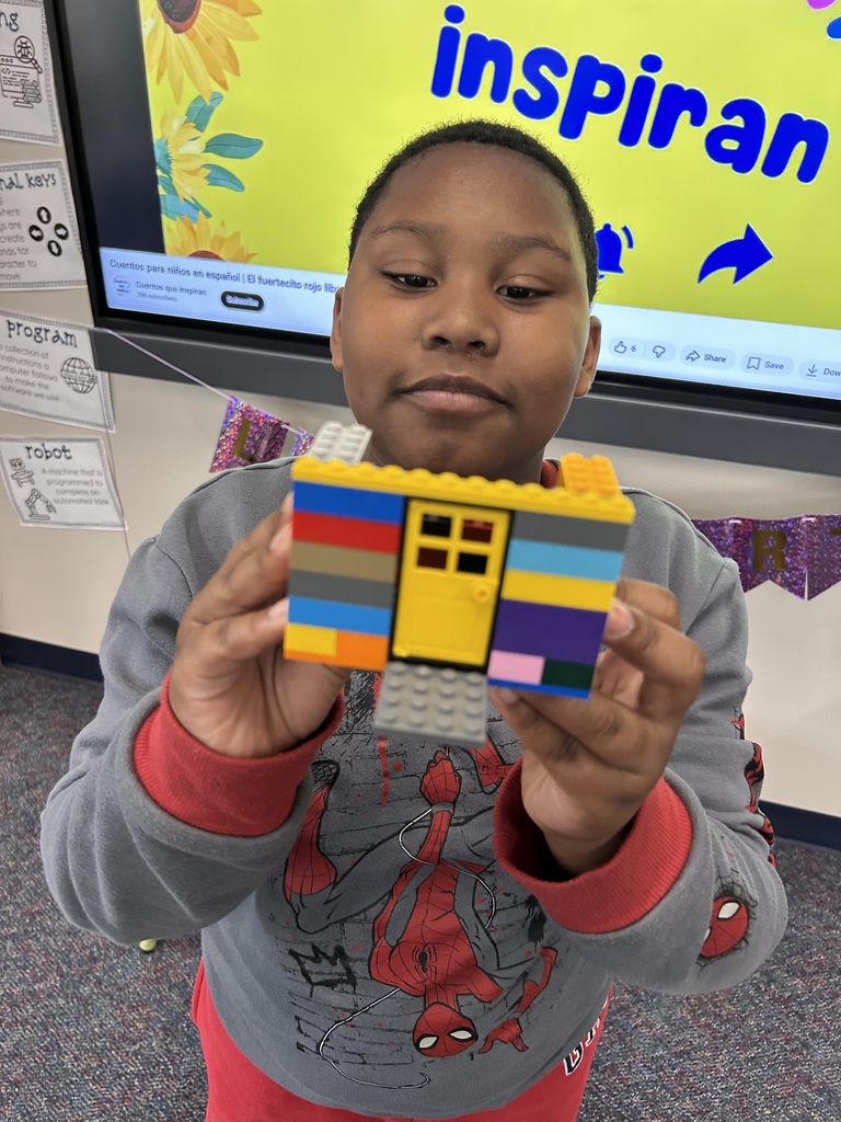 Students using Legos to  retell parts of a story