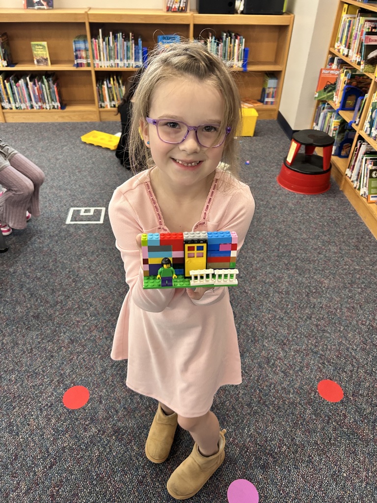Students using Legos to  retell parts of a story
