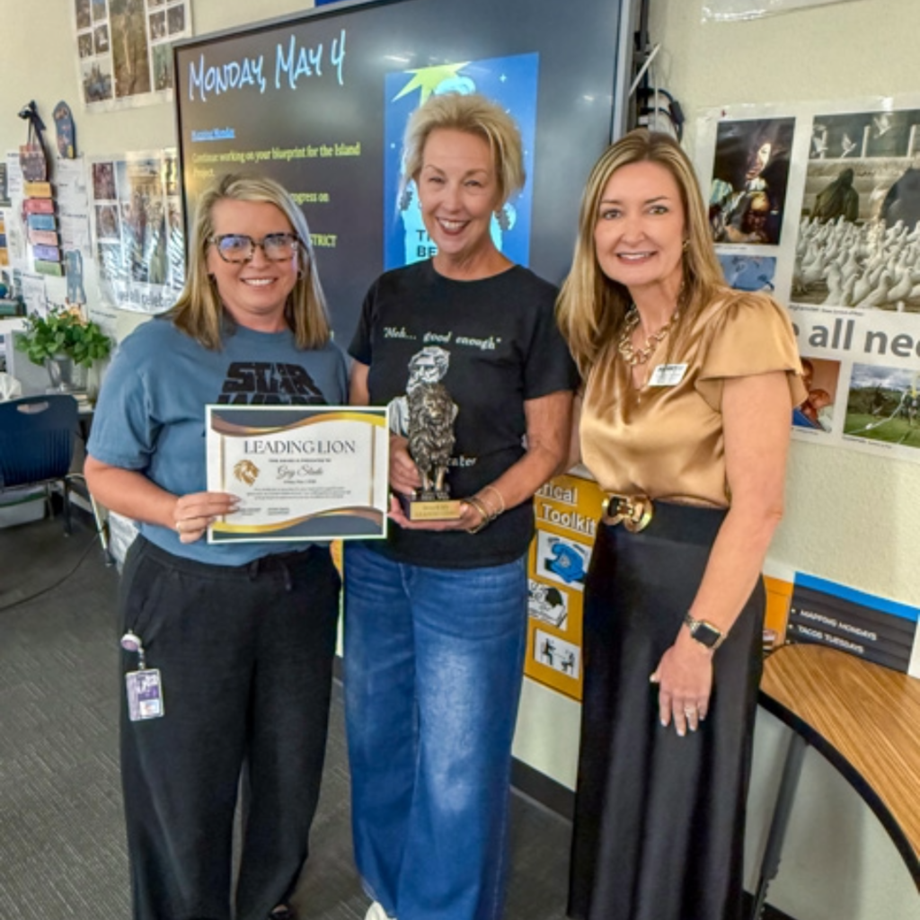 Assistant Superintendent of Teaching & Learning Dr. Amber Epperson poses for a photo with Dowell MIddle School staff 
