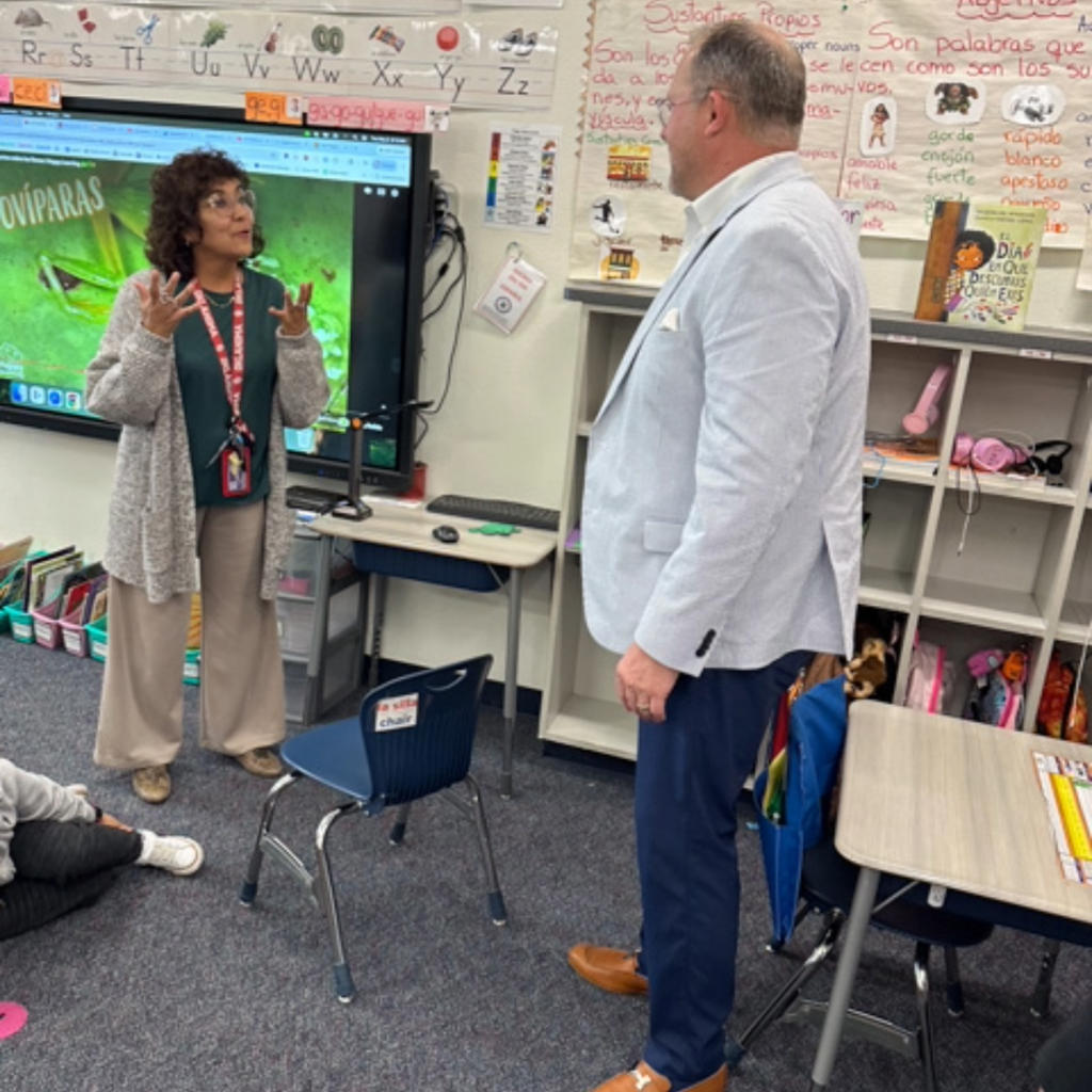 school board member corey homer visits a classroom 