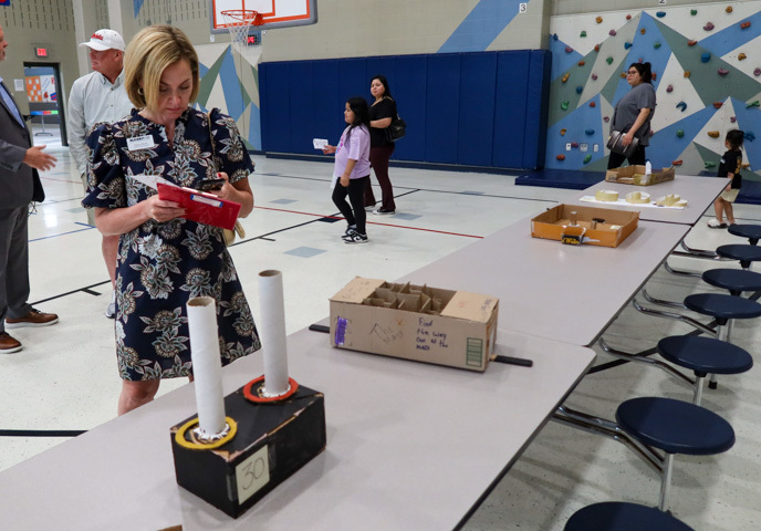 assistant superintendent of human resources alana chisum serves as a judge for the cardboard challenge 