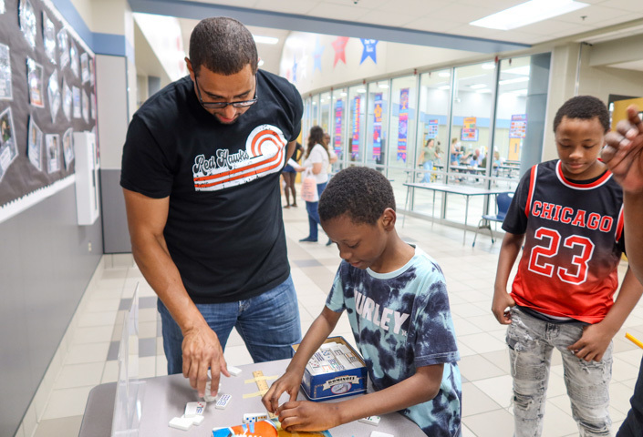 a student plays a game at malvern steam night 