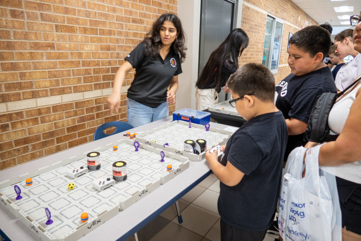 a student plays a game at malvern steam night 