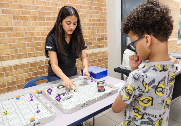 a student participates in a robotic activity