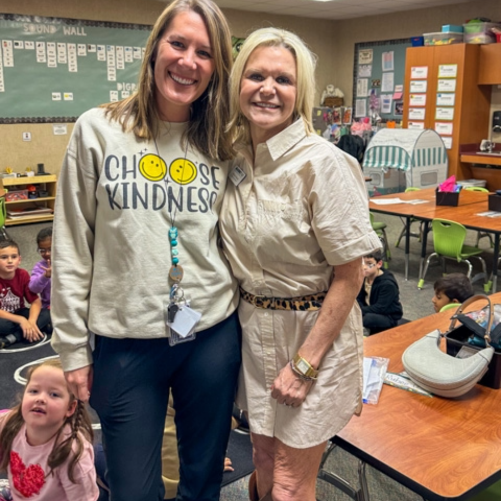 melanie raleeh takes a photo with mcclure teachers 