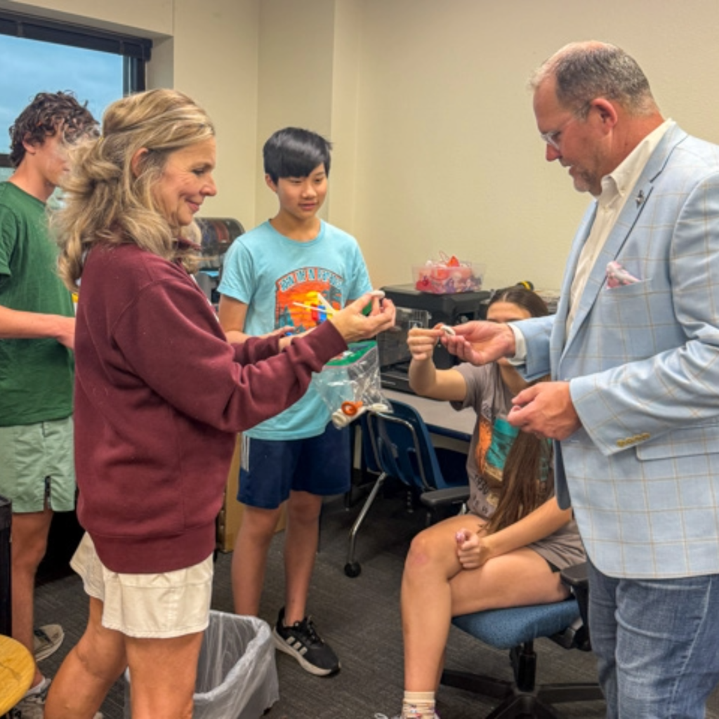 board member corey homer visits a classroom at dowell middle school 
