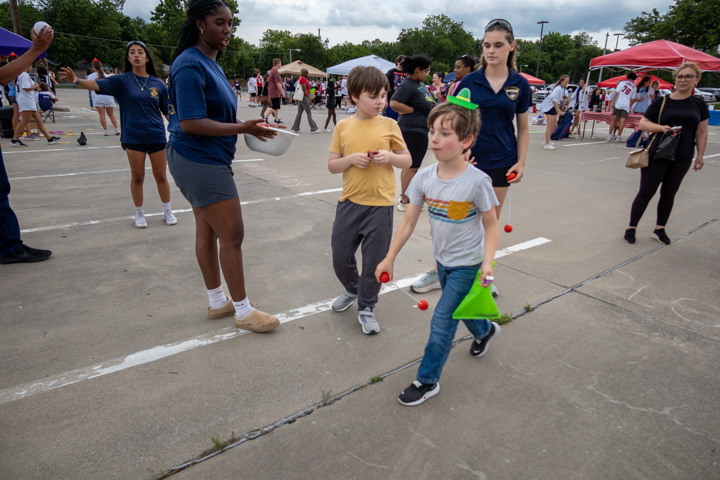 a student participates in a ring toss game