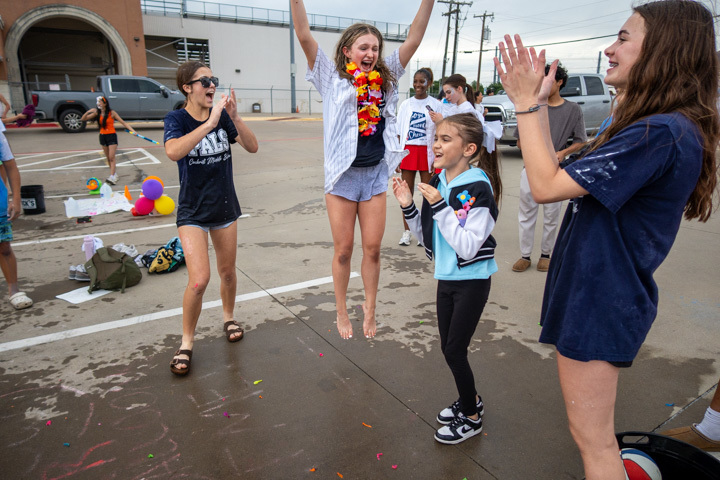 students cheer for a student 