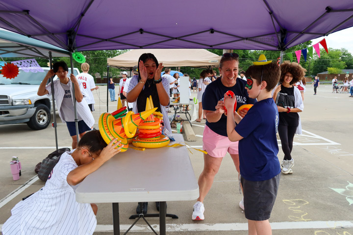 a student participates in a ring toss game 