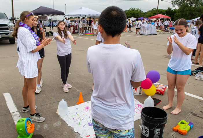 a student completes a ring toss game 