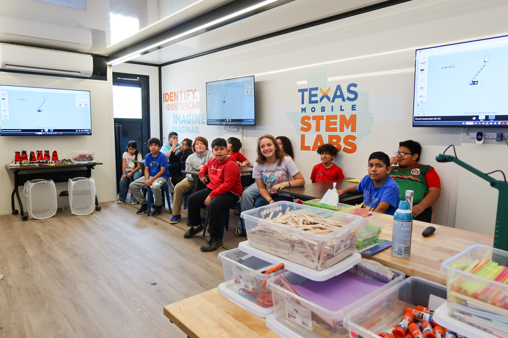 students listen to a lesson about circuits in the mobile stem lab 