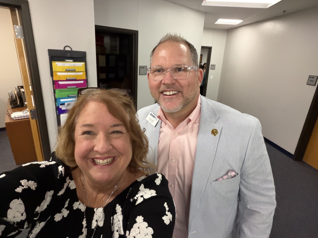 corey homer takes a photo with holly rogers the principal at SJMS 